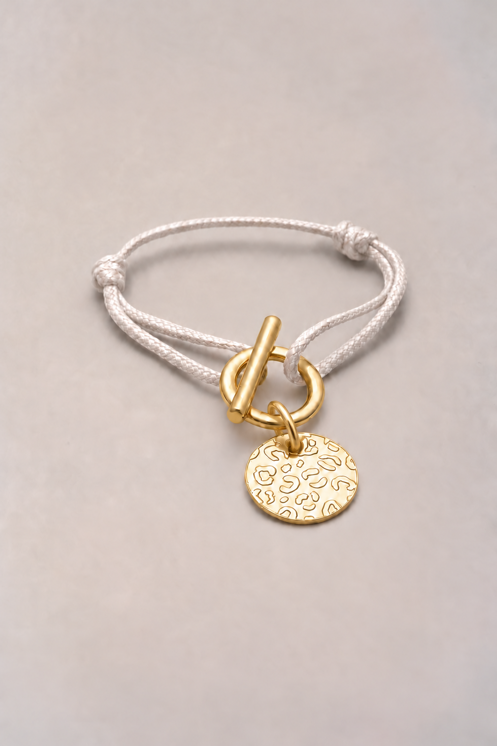 Bracelet attache léopard doré, cordon blanc et médaille léopard