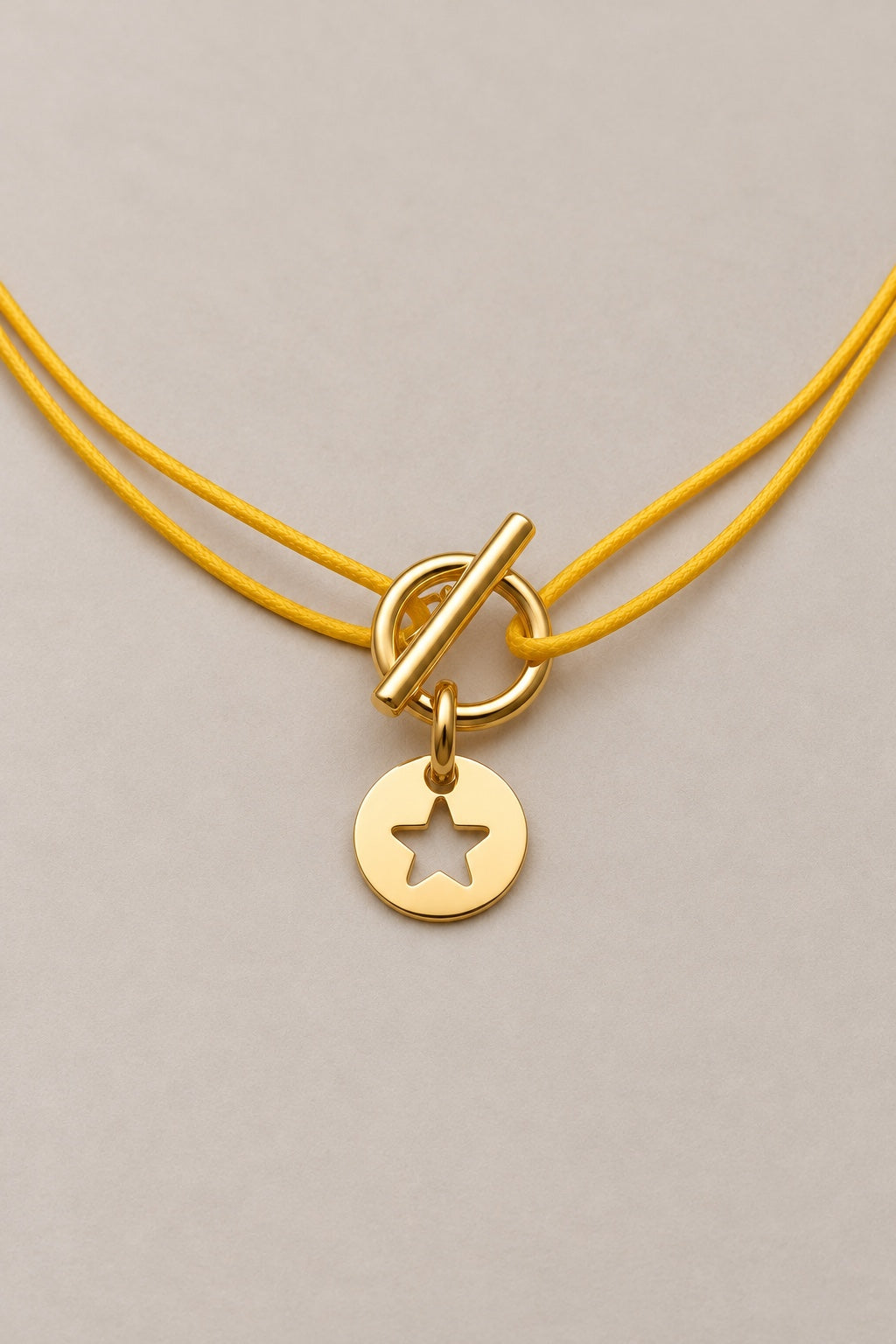 Collier attache étoile doré Musardise, cordon jaune